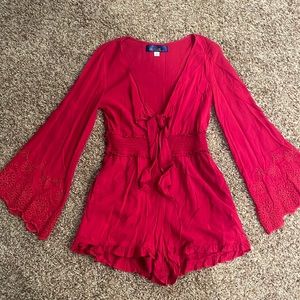 Red long sleeve romper. Size medium